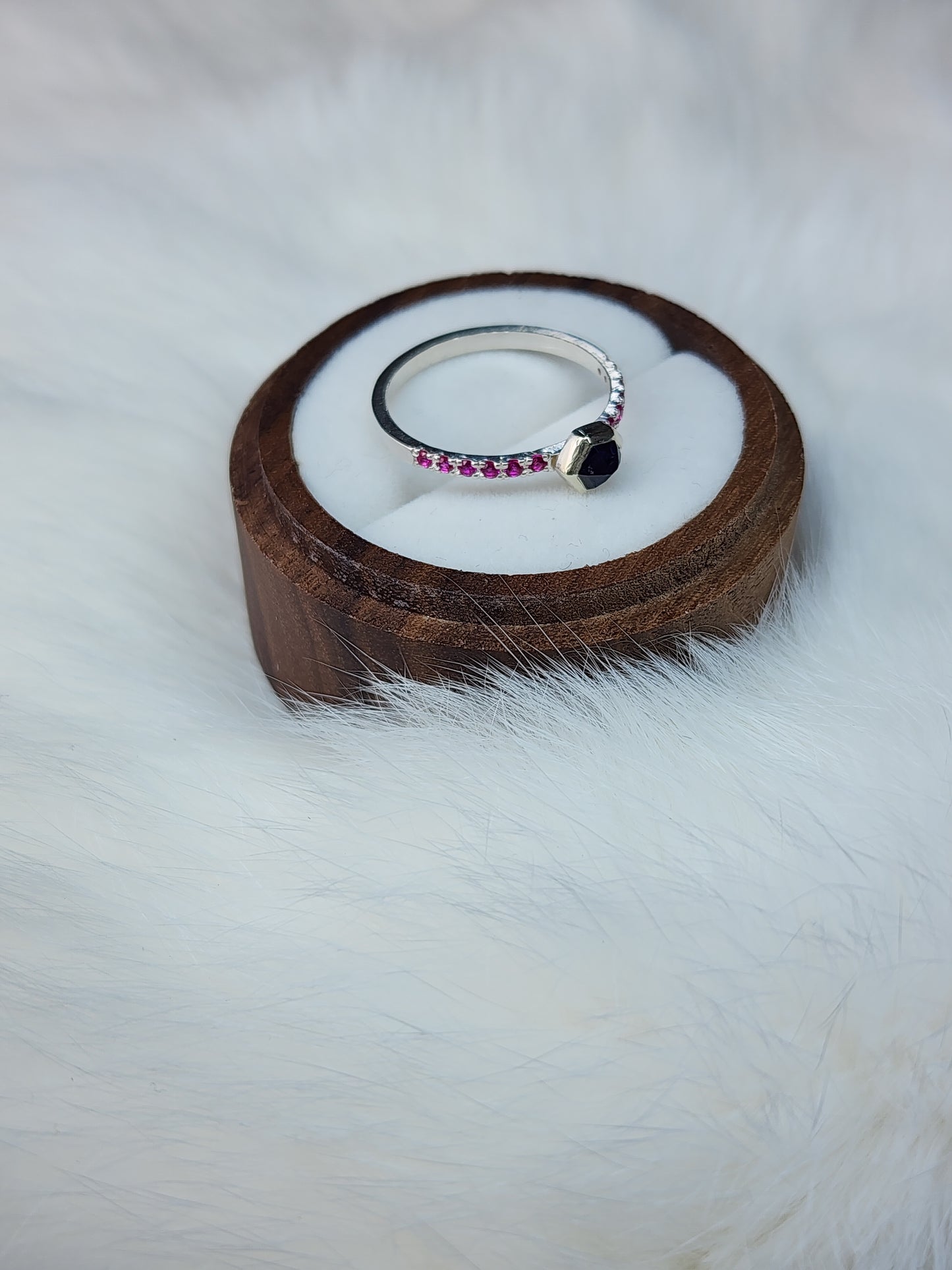 Dark blue horizontal natural winza sapphire, sterling silver ring, set in 10 karat yellow gold bezel with 12 synthetic 1.5mm rubies