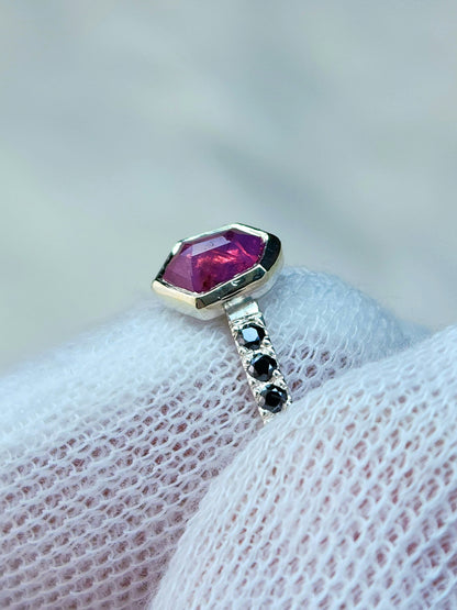 Opalescent pink sapphire shield winza sapphire sterling silver ring with 12-1.5 mm pave set black moissanites in a 10 karat yellow gold bezel