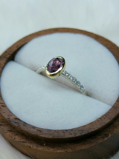 Oval pastel pink winza sapphire,14 karat yellow gold bezel, sterling silver ring, pave setting white moissanite