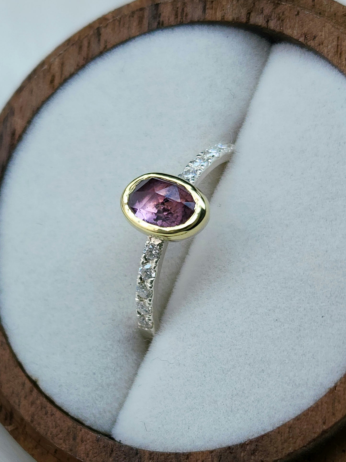 Oval pastel pink winza sapphire,14 karat yellow gold bezel, sterling silver ring, pave setting white moissanite