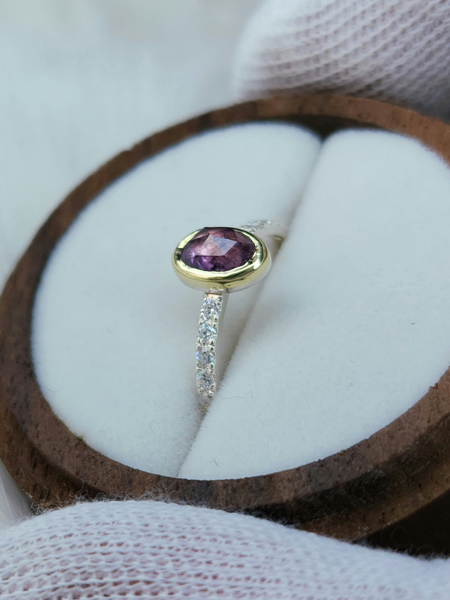 Oval pastel pink winza sapphire,14 karat yellow gold bezel, sterling silver ring, pave setting white moissanite
