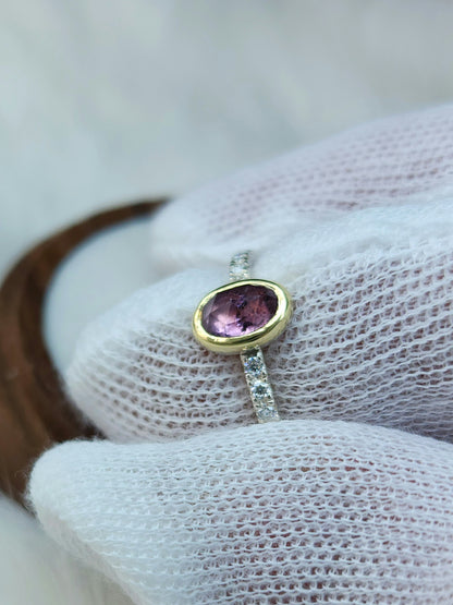 Oval pastel pink winza sapphire,14 karat yellow gold bezel, sterling silver ring, pave setting white moissanite