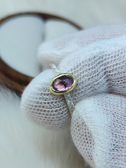 Oval pastel pink winza sapphire,14 karat yellow gold bezel, sterling silver ring, pave setting white moissanite