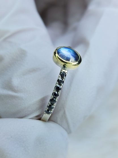 Rainbow moonstone ring, 14 karat yellow gold, bezel, 1.5mm diamond cut black moissanite pave