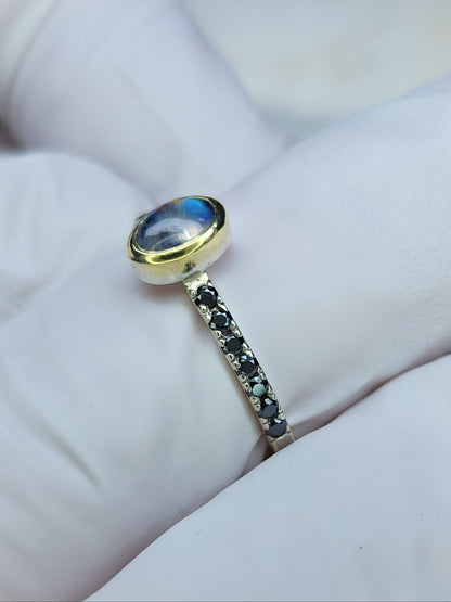 Rainbow moonstone ring, 14 karat yellow gold, bezel, 1.5mm diamond cut black moissanite pave