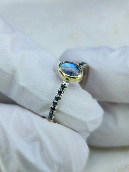 Rainbow moonstone ring, 14 karat yellow gold, bezel, 1.5mm diamond cut black moissanite pave