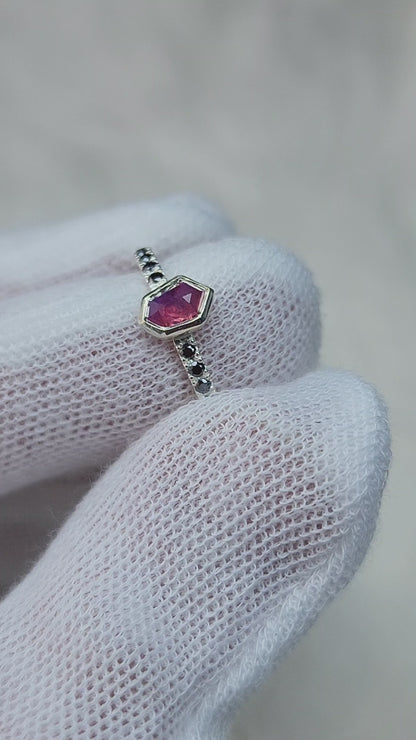 Opalescent pink sapphire shield winza sapphire sterling silver ring with 12-1.5 mm pave set black moissanites in a 10 karat yellow gold bezel