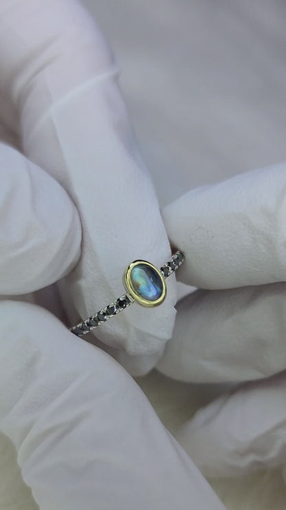 Rainbow moonstone ring, 14 karat yellow gold, bezel, 1.5mm diamond cut black moissanite pave