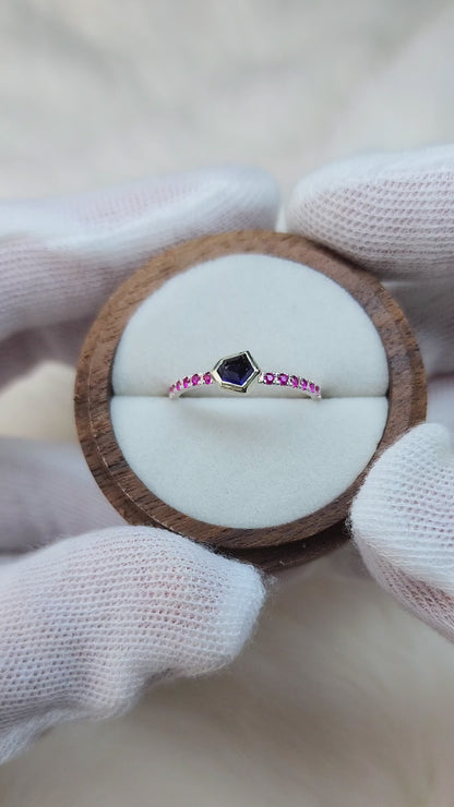 Dark blue horizontal natural winza sapphire,  sterling silver ring, set in 10 karat yellow gold bezel with 12 synthetic 1.5mm rubies